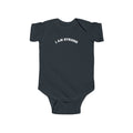 Bildsa I Am Strong White Text Baby Onesie
